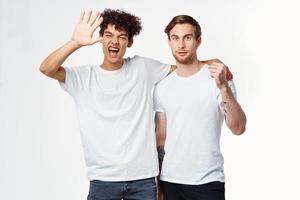 two men are standing next to clean t-shirts emotions photo