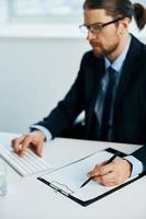 man in a suit at his desk manager work photo