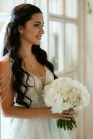 portrait of a bride in a white dress in a bright cafe photo