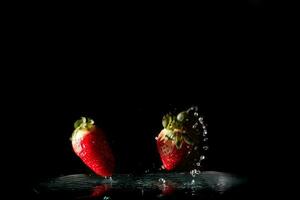 Fresh Strawberries with water splash photo