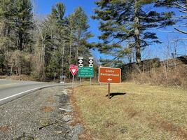 Mountain scenery valley waterfall road signs photo