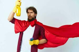 Man with detergent red raincoat professional work photo