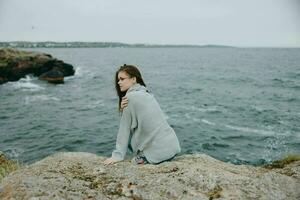 pretty woman beach tourism cloudy weather stone coast Relaxation concept photo