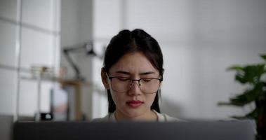 Handheld shot, Tired young woman worker in eyeglasses online work, Female employee overworked feeling eye strain after using laptop computer working from home video