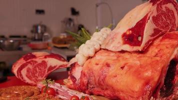 Appetizing meat products are on display on the table in butchery. video