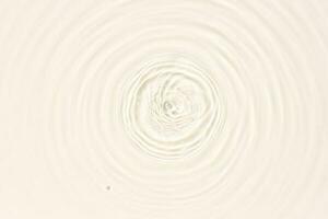 Water surface abstract background texture with splashes and bubbles. Beige color photo