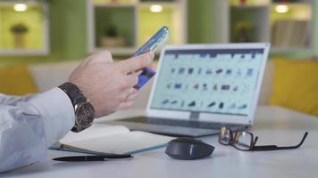 Close-up shot of man ordering from e-commerce. Man paying with credit card is ordering from e-commerce. video