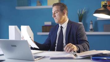 Successful businessman, completing his task, rejoices, victory. Positive happy businessman enjoying his success. He is proud at his desk in the office. video