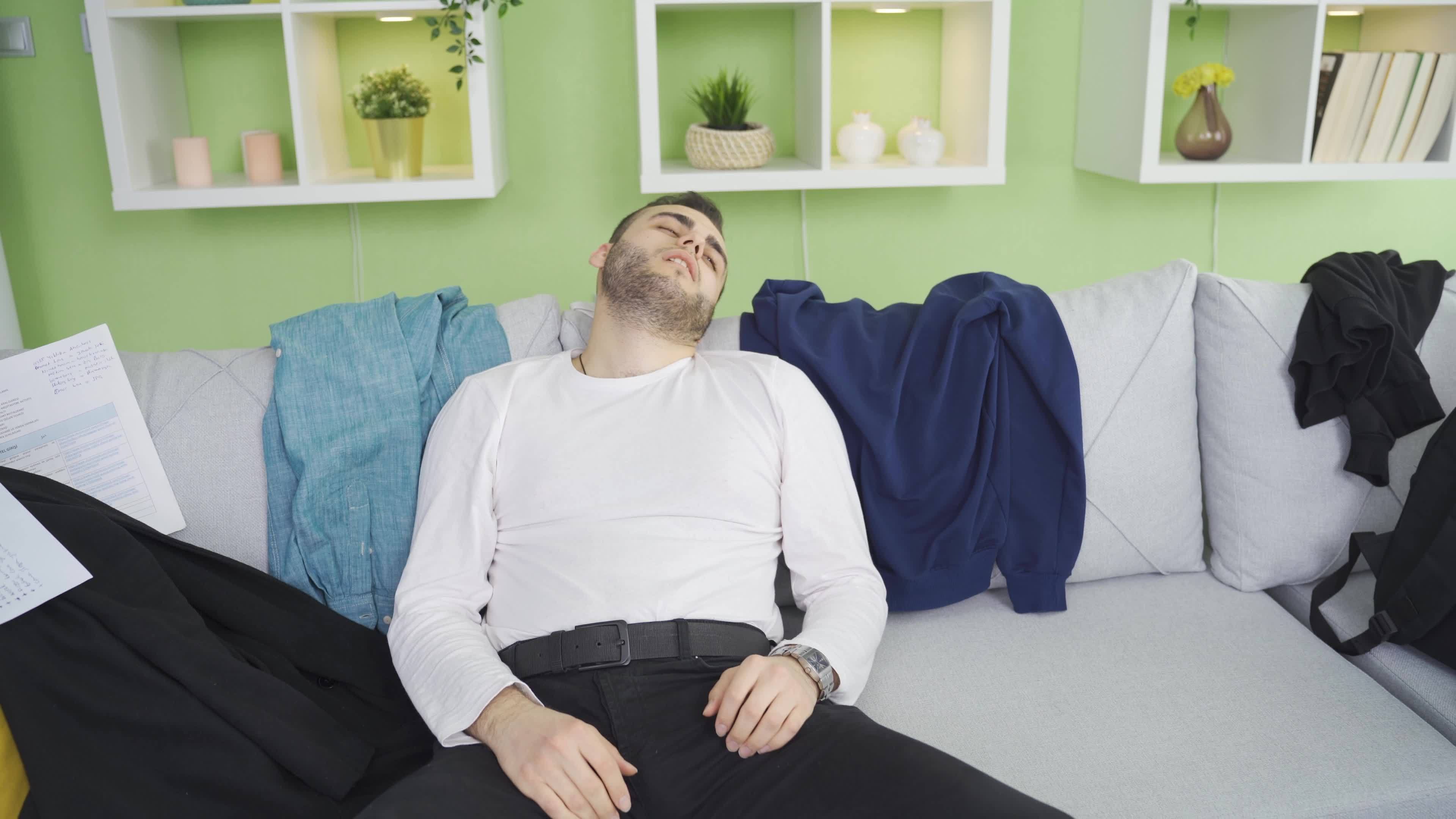 Lazy funny man sleeping in messy and dirty house. Relaxed man with lazy
