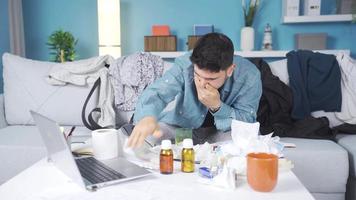 Messy and lazy man is sick, sneezing, not well. The sluggish young man who is very sick at home is working from home, having problems. video