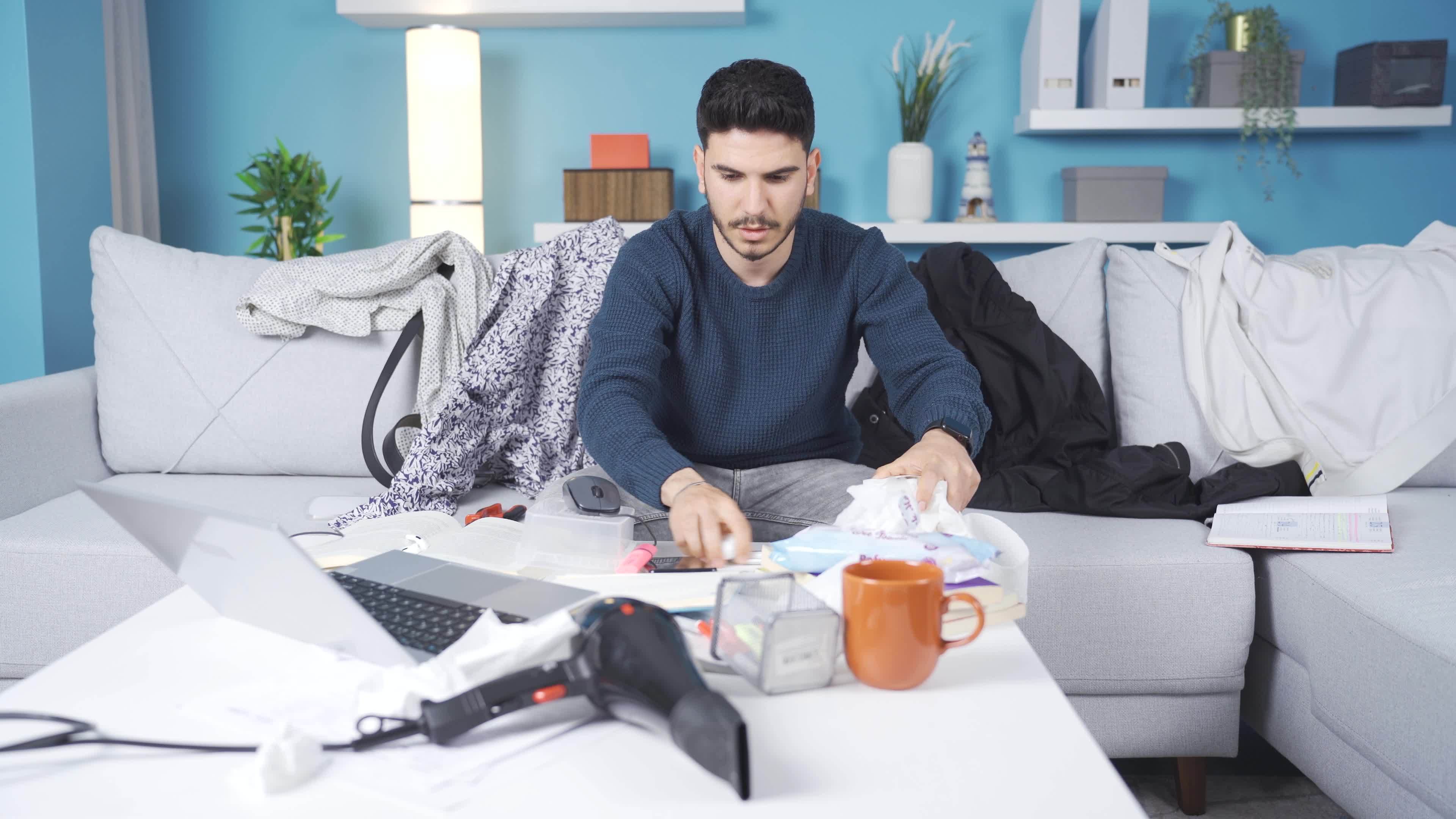 Suffering from his clutter and laziness, the young man gets angry. The