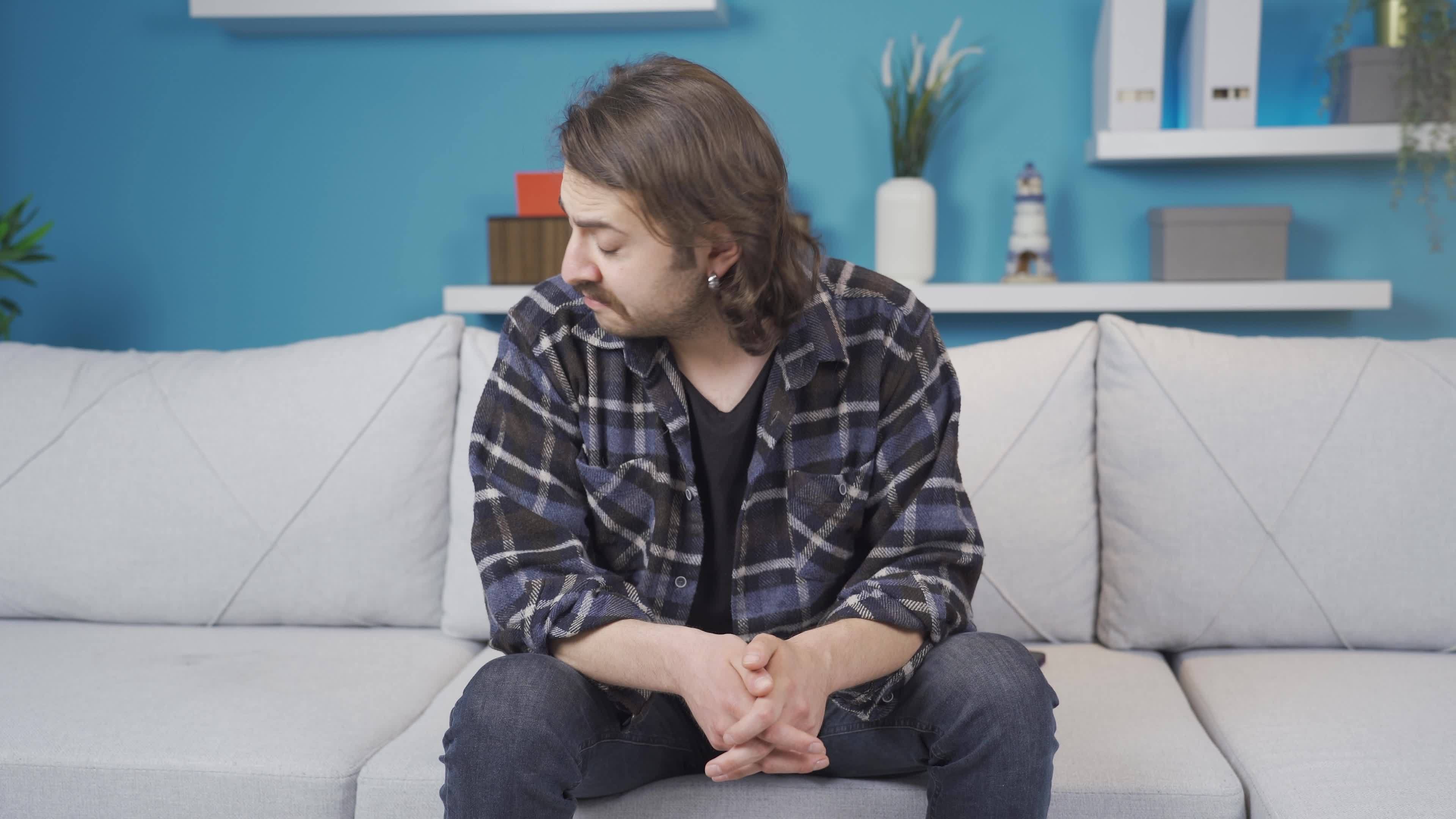 Tired of being alone, the man is helpless. The young man living alone