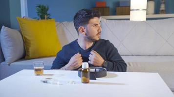Drug addicted man goes into crisis, trembles, gets depressed.  The man trying to quit drugs at home is struggling, he doesn't want to hit the syringe. video