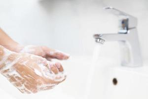 Wash your hands to prevent germs. photo