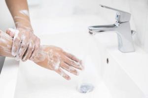 Wash your hands to prevent germs. photo