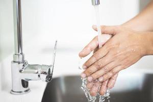 Wash your hands to prevent germs. photo