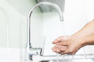 Wash your hands to prevent germs. photo