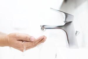 Wash your hands to prevent germs. photo