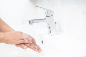 Wash your hands to prevent germs. photo