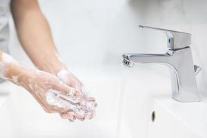 Wash your hands to prevent germs. photo