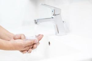 Wash your hands to prevent germs. photo