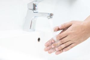 Wash your hands to prevent germs. photo