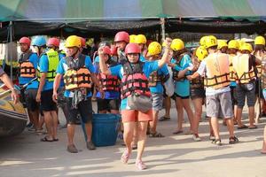 NAKHONNAYOK, THAILAND,DECEMBER 19  Group of adventurer doing white water rafting at dam, on December 19, 2015,The river is popular for its scenic nature view. photo