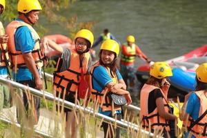 NAKHONNAYOK, THAILAND,DECEMBER 19  Group of adventurer doing white water rafting at dam, on December 19, 2015,The river is popular for its scenic nature view. photo