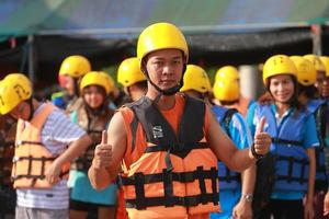 NAKHONNAYOK, THAILAND,DECEMBER 19  Group of adventurer doing white water rafting at dam, on December 19, 2015,The river is popular for its scenic nature view. photo