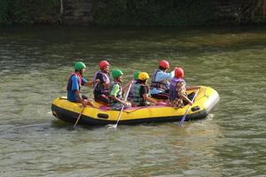 NAKHONNAYOK, THAILAND,DECEMBER 19  Group of adventurer doing white water rafting at dam, on December 19, 2015,The river is popular for its scenic nature view. photo