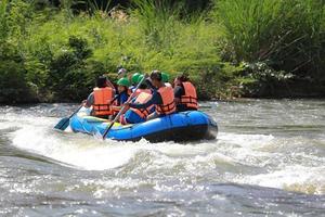 NAKHONNAYOK, THAILAND,DECEMBER 19  Group of adventurer doing white water rafting at dam, on December 19, 2015,The river is popular for its scenic nature view. photo