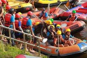 NAKHONNAYOK, THAILAND,DECEMBER 19  Group of adventurer doing white water rafting at dam, on December 19, 2015,The river is popular for its scenic nature view. photo