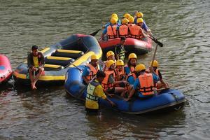 NAKHONNAYOK, THAILAND,DECEMBER 19  Group of adventurer doing white water rafting at dam, on December 19, 2015,The river is popular for its scenic nature view. photo