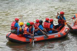 NAKHONNAYOK, THAILAND,DECEMBER 19  Group of adventurer doing white water rafting at dam, on December 19, 2015,The river is popular for its scenic nature view. photo