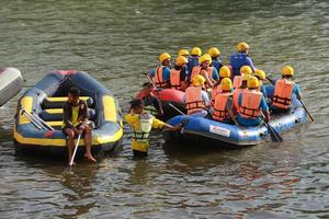 NAKHONNAYOK, THAILAND,DECEMBER 19  Group of adventurer doing white water rafting at dam, on December 19, 2015,The river is popular for its scenic nature view. photo