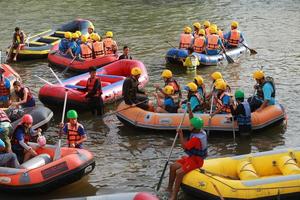 NAKHONNAYOK, THAILAND,DECEMBER 19  Group of adventurer doing white water rafting at dam, on December 19, 2015,The river is popular for its scenic nature view. photo