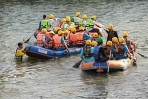 NAKHONNAYOK, THAILAND,DECEMBER 19  Group of adventurer doing white water rafting at dam, on December 19, 2015,The river is popular for its scenic nature view. photo