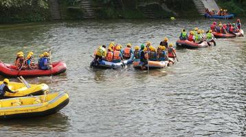 NAKHONNAYOK, THAILAND,DECEMBER 19  Group of adventurer doing white water rafting at dam, on December 19, 2015,The river is popular for its scenic nature view. photo