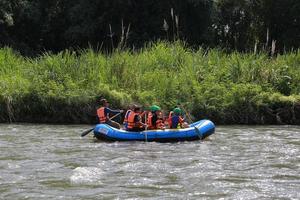 NAKHONNAYOK, THAILAND,DECEMBER 19  Group of adventurer doing white water rafting at dam, on December 19, 2015,The river is popular for its scenic nature view. photo