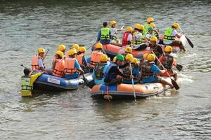 NAKHONNAYOK, THAILAND,DECEMBER 19  Group of adventurer doing white water rafting at dam, on December 19, 2015,The river is popular for its scenic nature view. photo