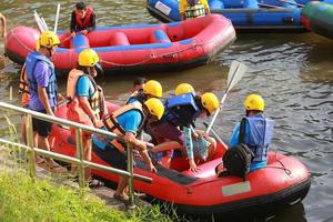 NAKHONNAYOK, THAILAND,DECEMBER 19  Group of adventurer doing white water rafting at dam, on December 19, 2015,The river is popular for its scenic nature view. photo