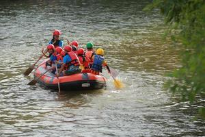 NAKHONNAYOK, THAILAND,DECEMBER 19  Group of adventurer doing white water rafting at dam, on December 19, 2015,The river is popular for its scenic nature view. photo