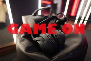 Game on concept. Professional headphones with microphone and vr glasses for video games and cyber sports on background. photo