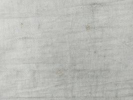 Close-up of Rustic Old Fabric Natural Linen Texture Background. Grunge white background photo