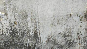 Old grunge crack grey concrete or cement wall texture background with dry moss photo