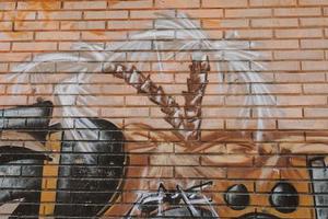 graffiti on a beige brick wall urban background photo