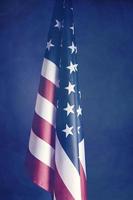 Flag United States America dark blurry background.Banner of America retro style. photo