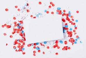 business card mockup on colorful circle confetti, decorations for fourth july photo