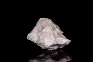 Macro mineral stone Wollastonite on black background photo