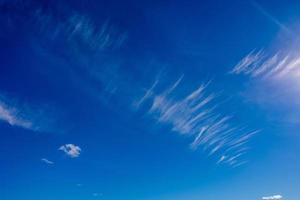 natural landscape background with blue sky, sun and white clouds photo